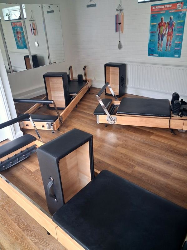 Close view of a reformer and its sitting box in the studio